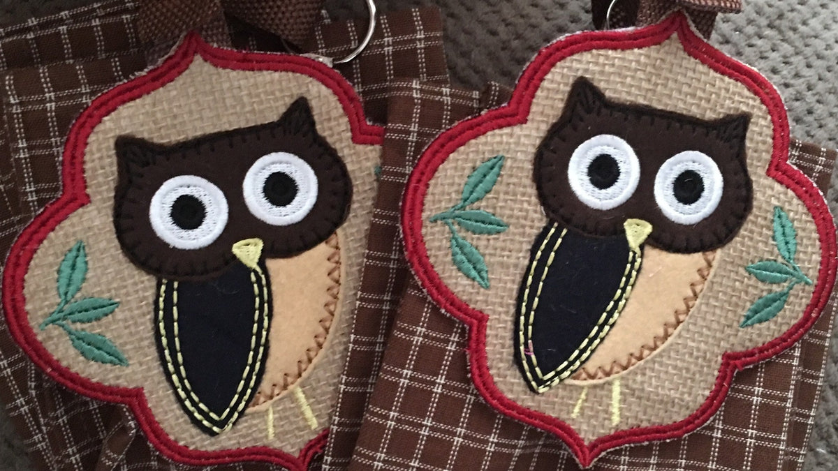 Two handmade owl towel toppers with embroidered owls, made in Louisville, KY