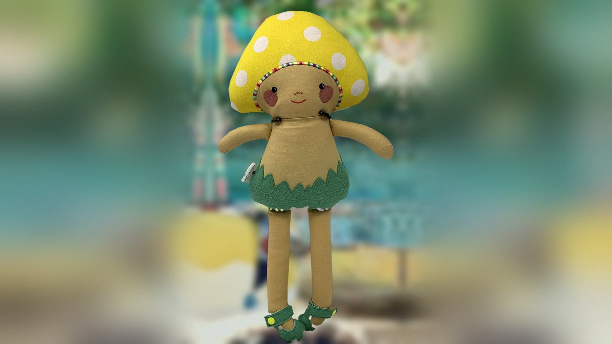 Handmade yellow mushroom cloth doll with a green felt skirt, sewn in Louisville, KY