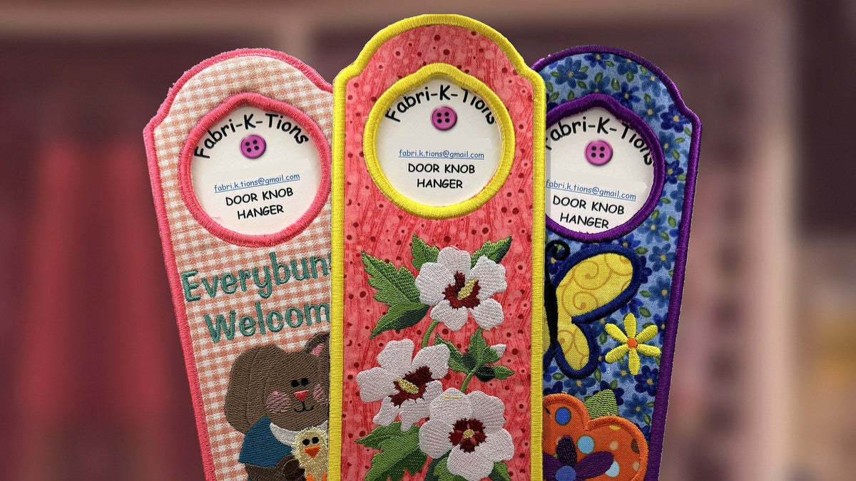 Three embroidered door knob hangers: Everybunny Welcome, Rose of Sharon flowers and a butterfly, handmade in Louisville, KY