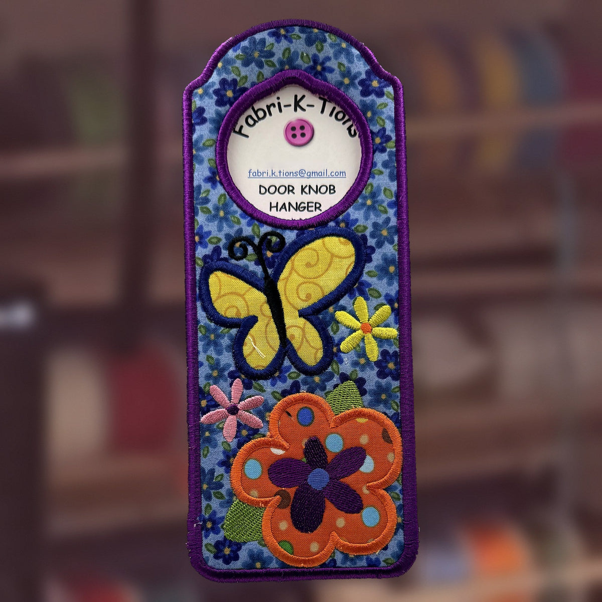 Bold Flowers Door Knob Hanger, an embroidered fabric door hanger, handmade in Louisville, KY