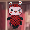 Plushie Ladybug in red polka dots with a pink felt face, handmade in Louisville, KY