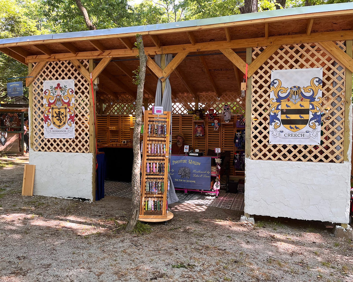 Fabri-K-Tions booth inside a wooden festival stall with lattice walls