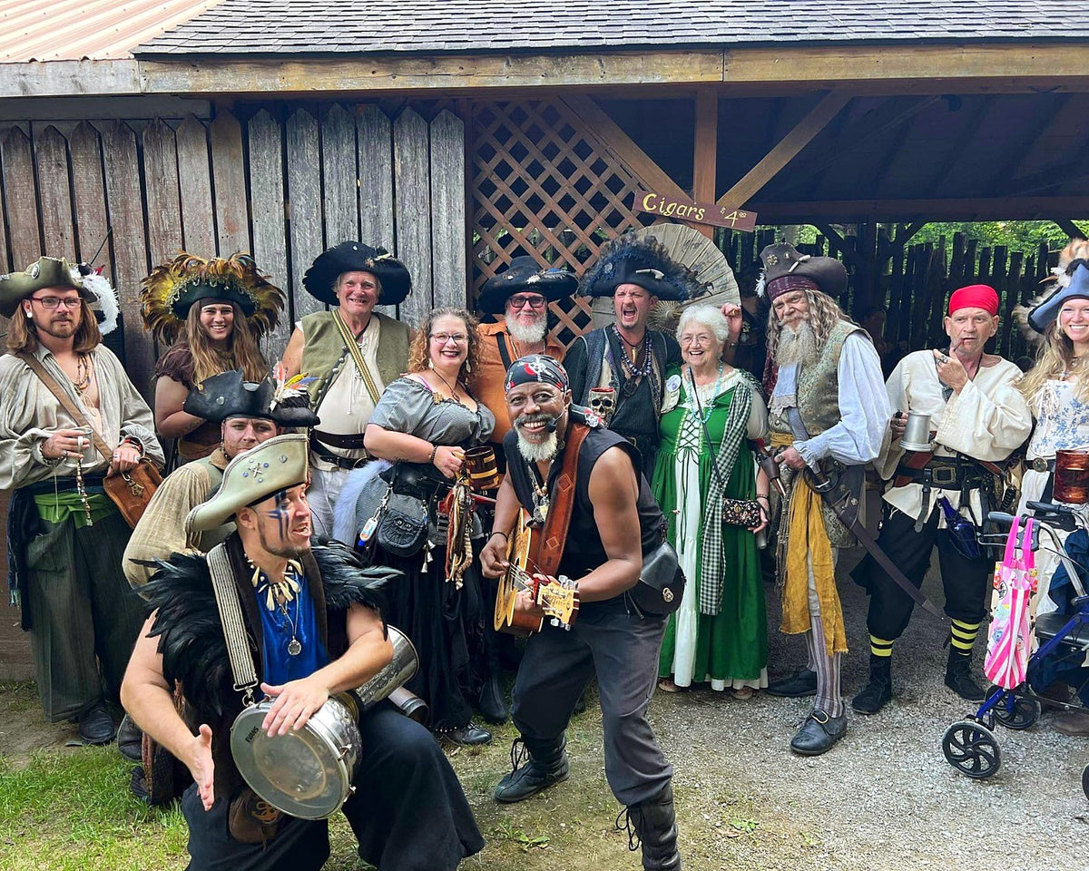 Costumed pirate crew posing together at a Renaissance festival