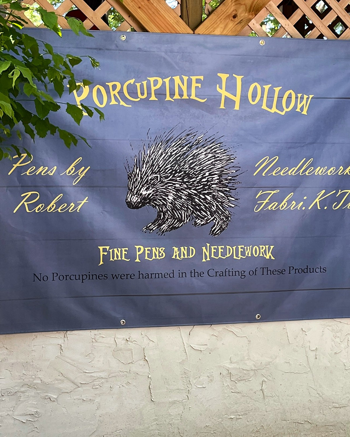 Porcupine Hollow banner for fine pens and needlework by Fabri-K-Tions at a festival booth