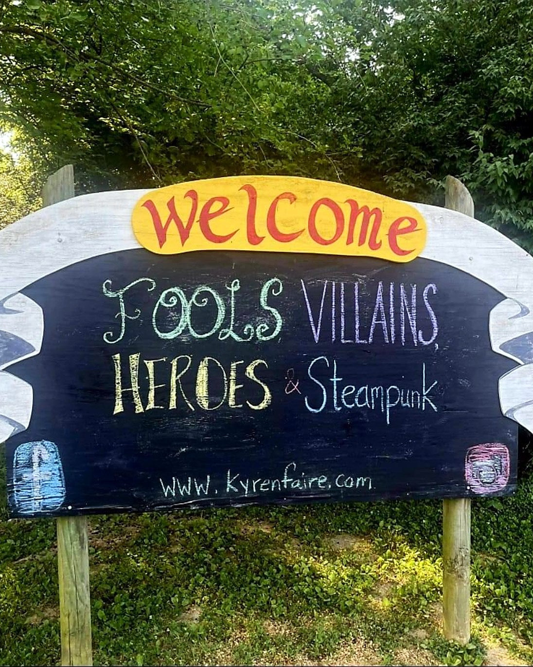 Hand-painted festival welcome sign for Fools, Villains, Heroes and Steampunk weekend