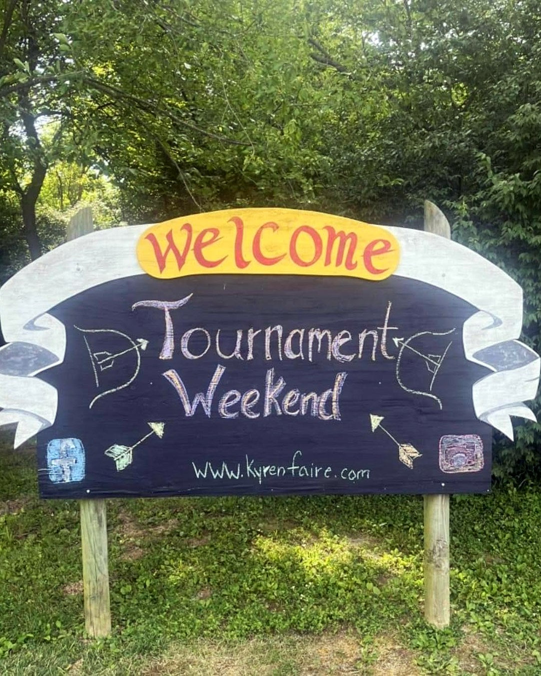 Hand-painted Tournament Weekend festival welcome sign